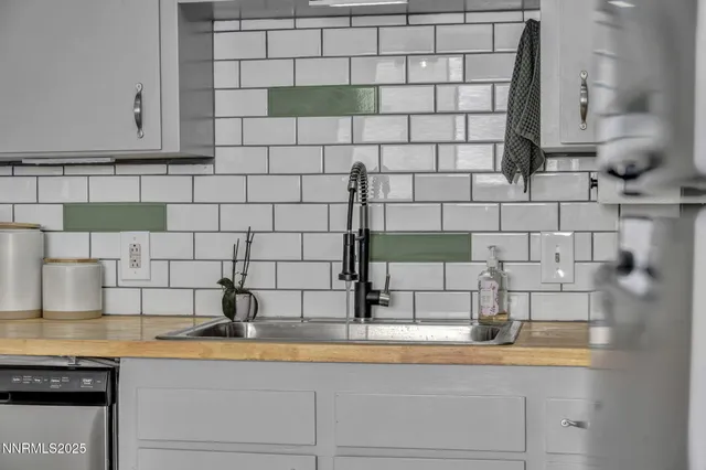 a bathroom with a sink and a granite counter tops