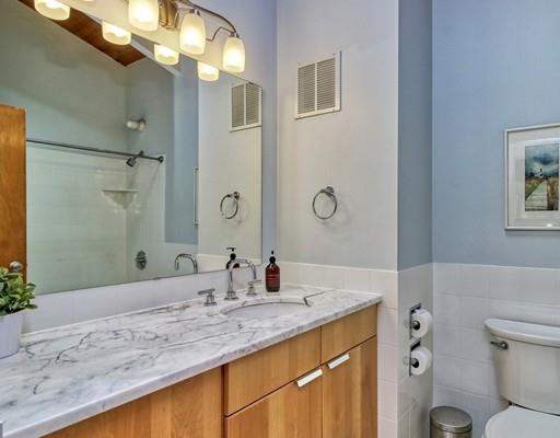 12 Meadowbrook Road Lincoln, MA 01773 - Photo 23 of 30 a bathroom with a granite countertop sink toilet and shower