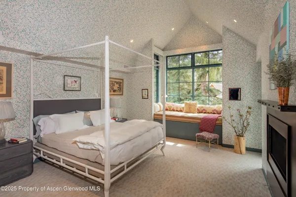 a bed room with a bed and a couch