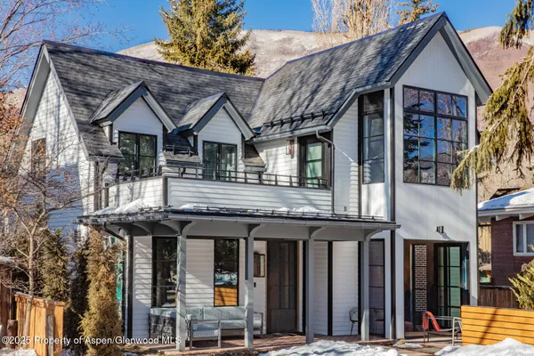 a view of a house with large windows