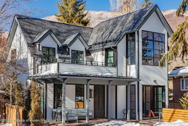 a view of a house with large windows