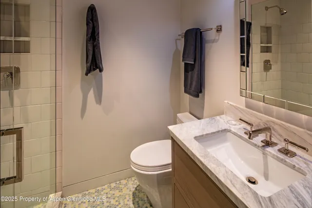 a bedroom with a bed and dresser