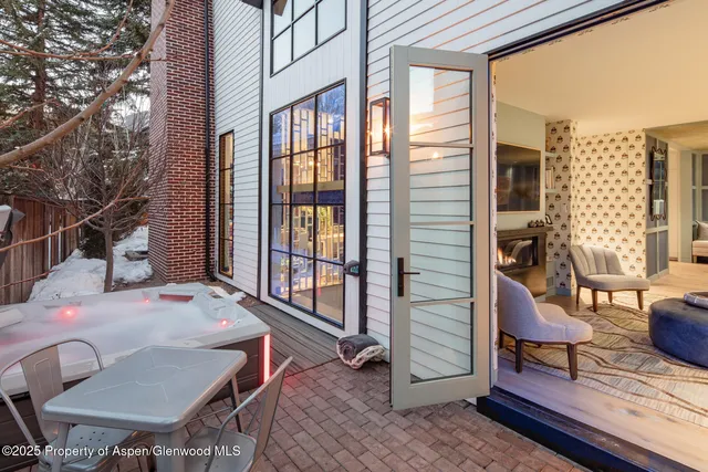 a outdoor space with a table and chairs