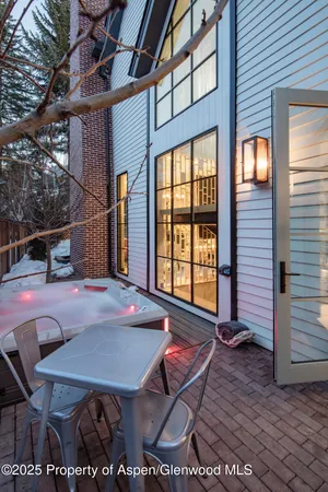 a view of a brick house with a large window