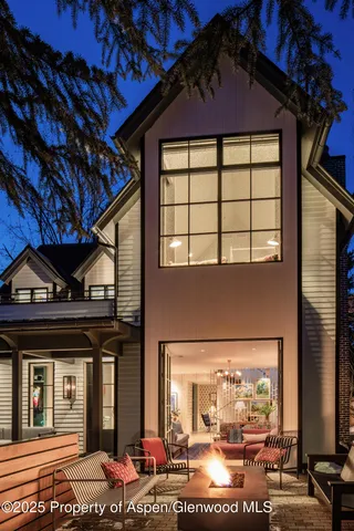 a front view of a house with a garden and plants