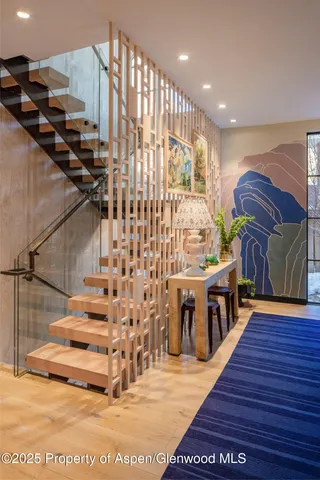 a view of entryway with wooden floor