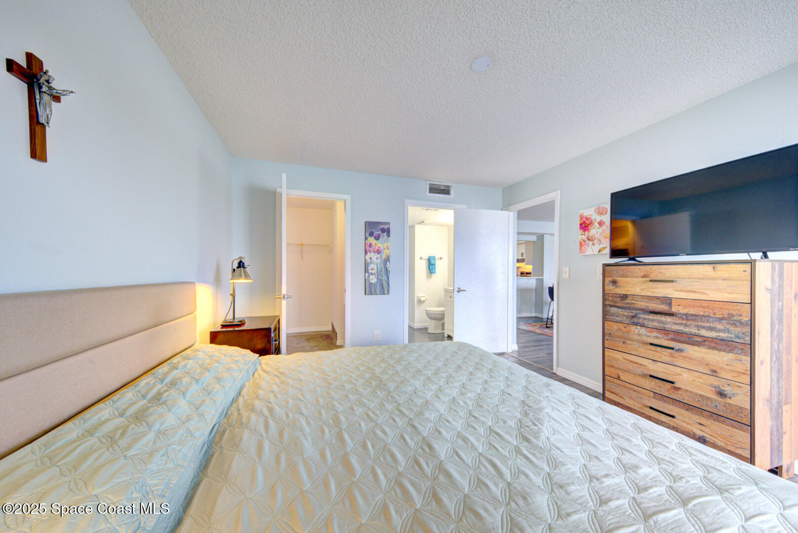 190 Seminole Lane, Unit 503 Cocoa Beach, FL 32931 - Photo 11 of 31 master bedroom with ensuite