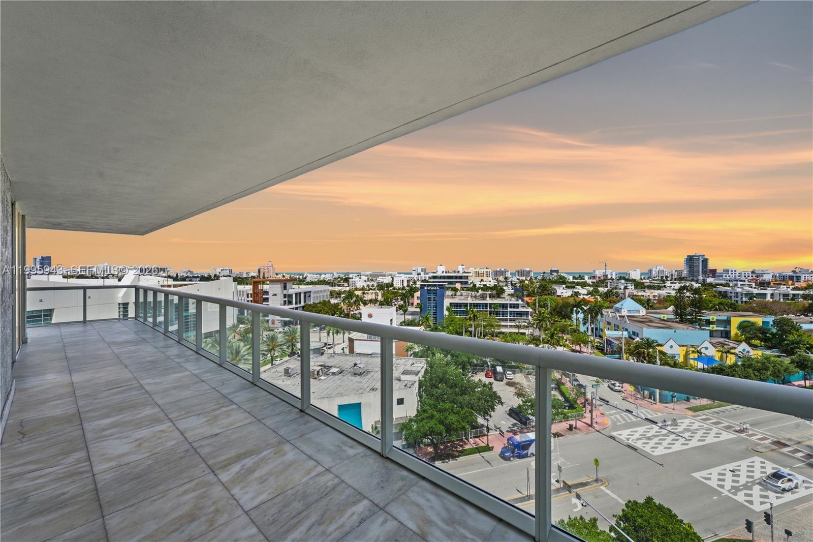450 Alton Road, Unit 910 Miami Beach, FL 33139 - Photo 5 of 59 a view of a city from a balcony with city view
