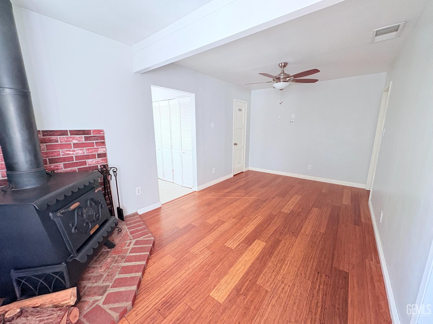 Undisclosed Address Bakersfield, CA 93301 - Photo 6 of 11 a bedroom with a bed and a flat screen tv