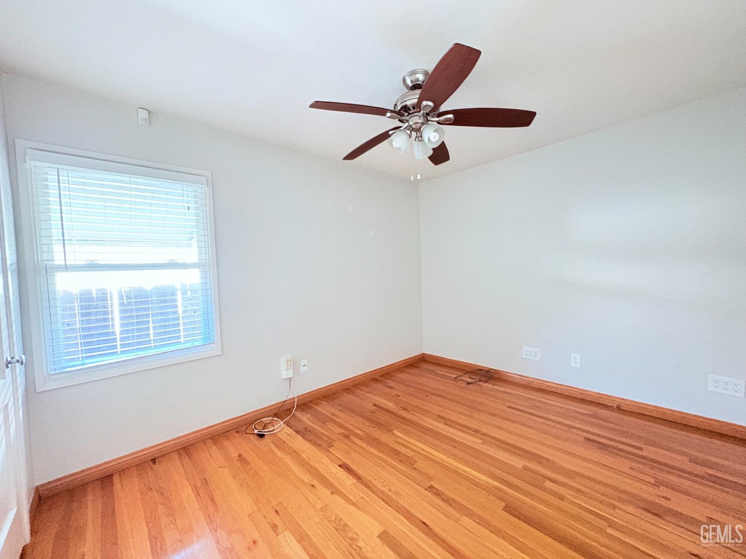 Undisclosed Address Bakersfield, CA 93301 - Photo 7 of 11 a view of empty room with wooden floor