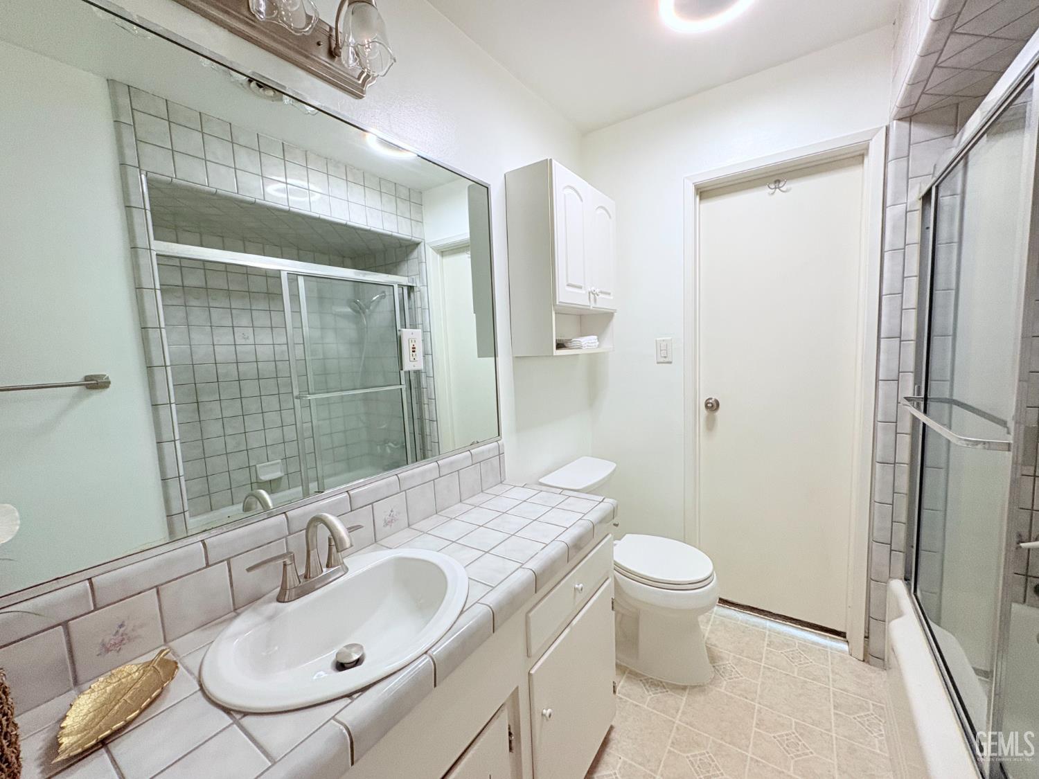 Undisclosed Address Bakersfield, CA 93301 - Photo 9 of 11 a bathroom with a sink toilet and shower