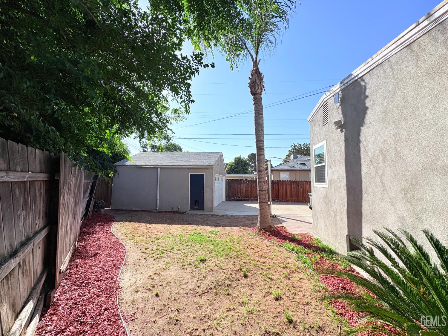 Undisclosed Address Bakersfield, CA 93301 - Photo 10 of 11 a view of backyard with seating space and trees