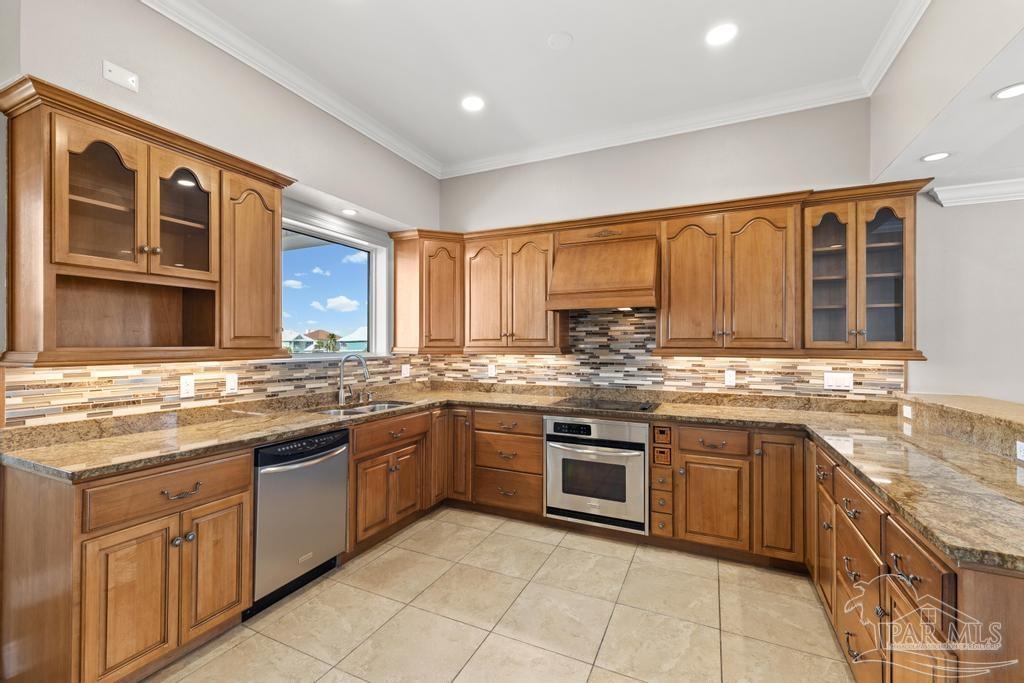 321 Gulfview Lane Perdido Key, FL 32507 - Photo 7 of 57 a kitchen with a sink stove and cabinets