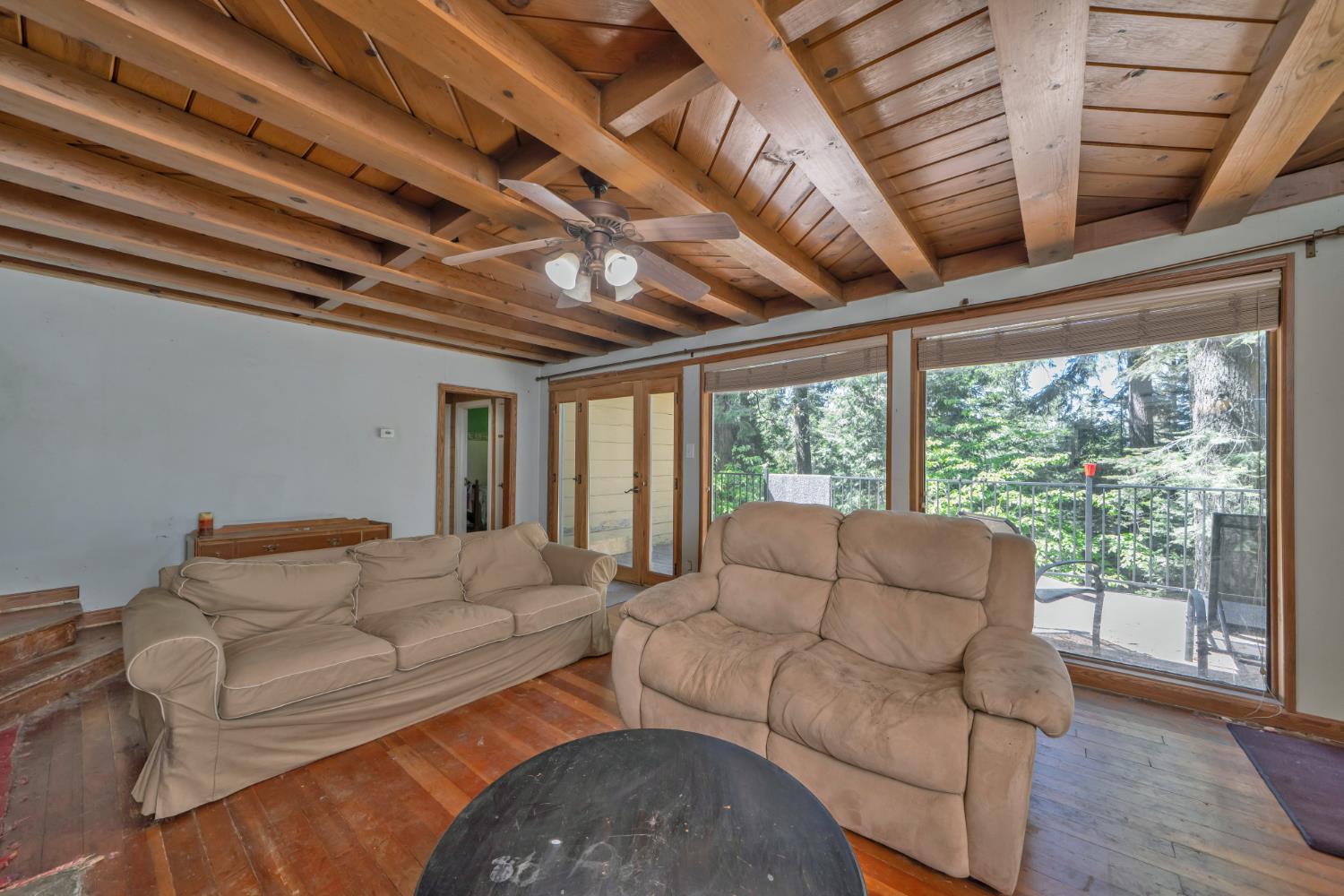 6929 Split Bend Road Pollock Pines, CA 95726 - Photo 24 of 38 a living room with furniture and a large window
