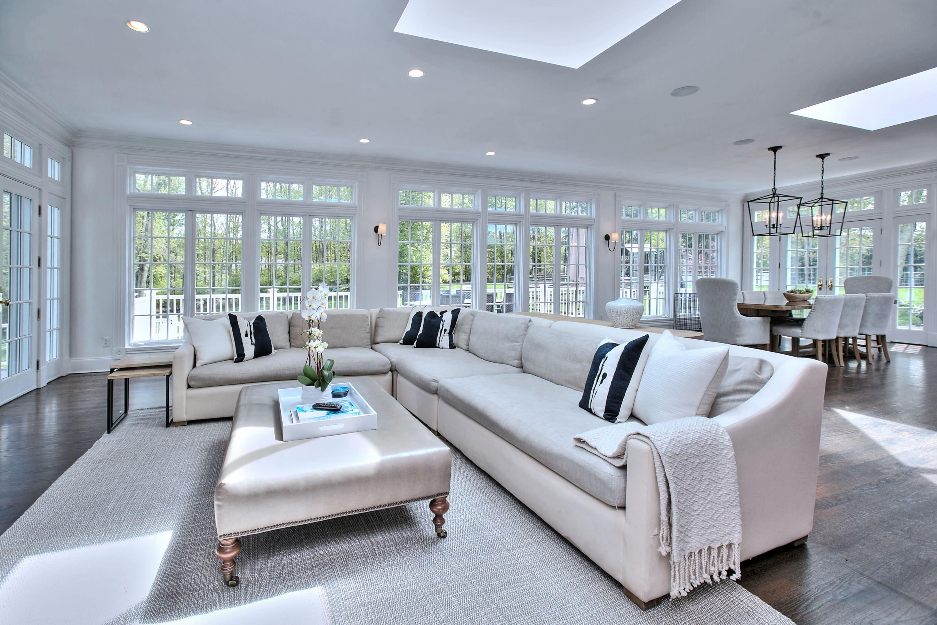 1313 Smith Ridge Road New Canaan, CT 06840 - Photo 14 of 40 a living room with furniture and a large window