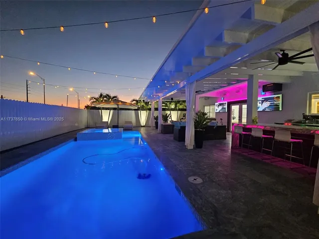 a lobby with furniture and flat screen tv