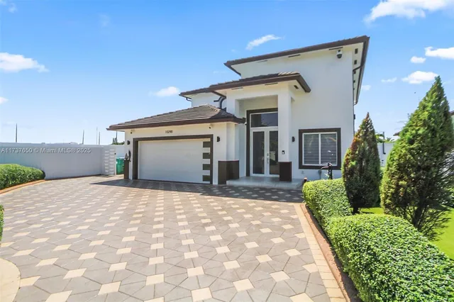 a front view of a house with garden