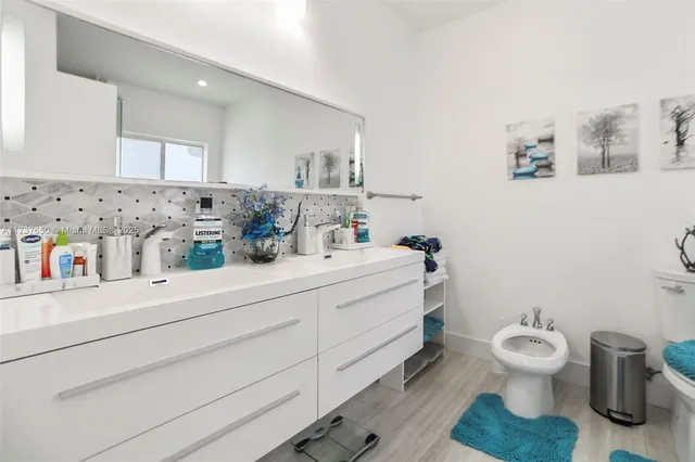 a view of a house with backyard porch and sitting area