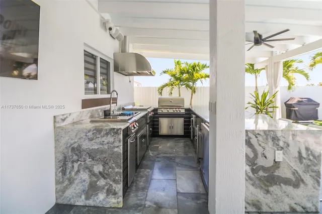 a view of living room kitchen with table and chairs