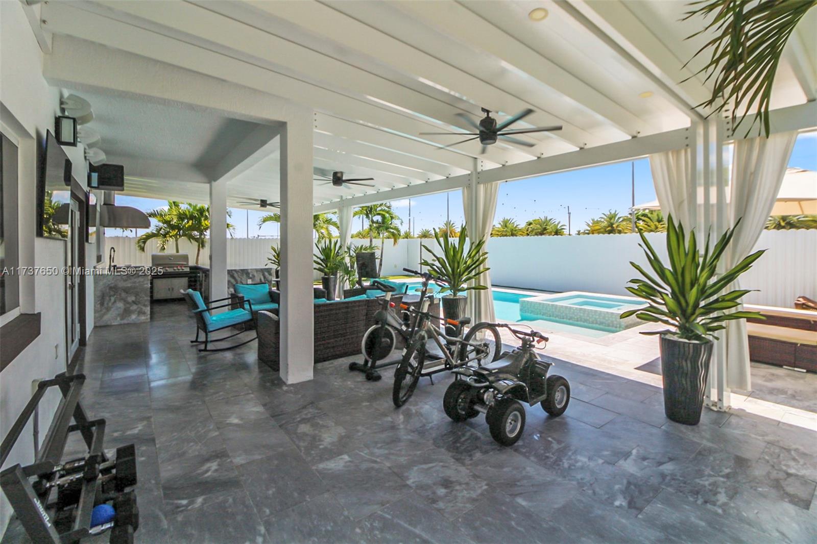 10290 Southwest 7th Terrace Sweetwater, FL 33174 - Photo 35 of 58 a view of a room with gym equipment