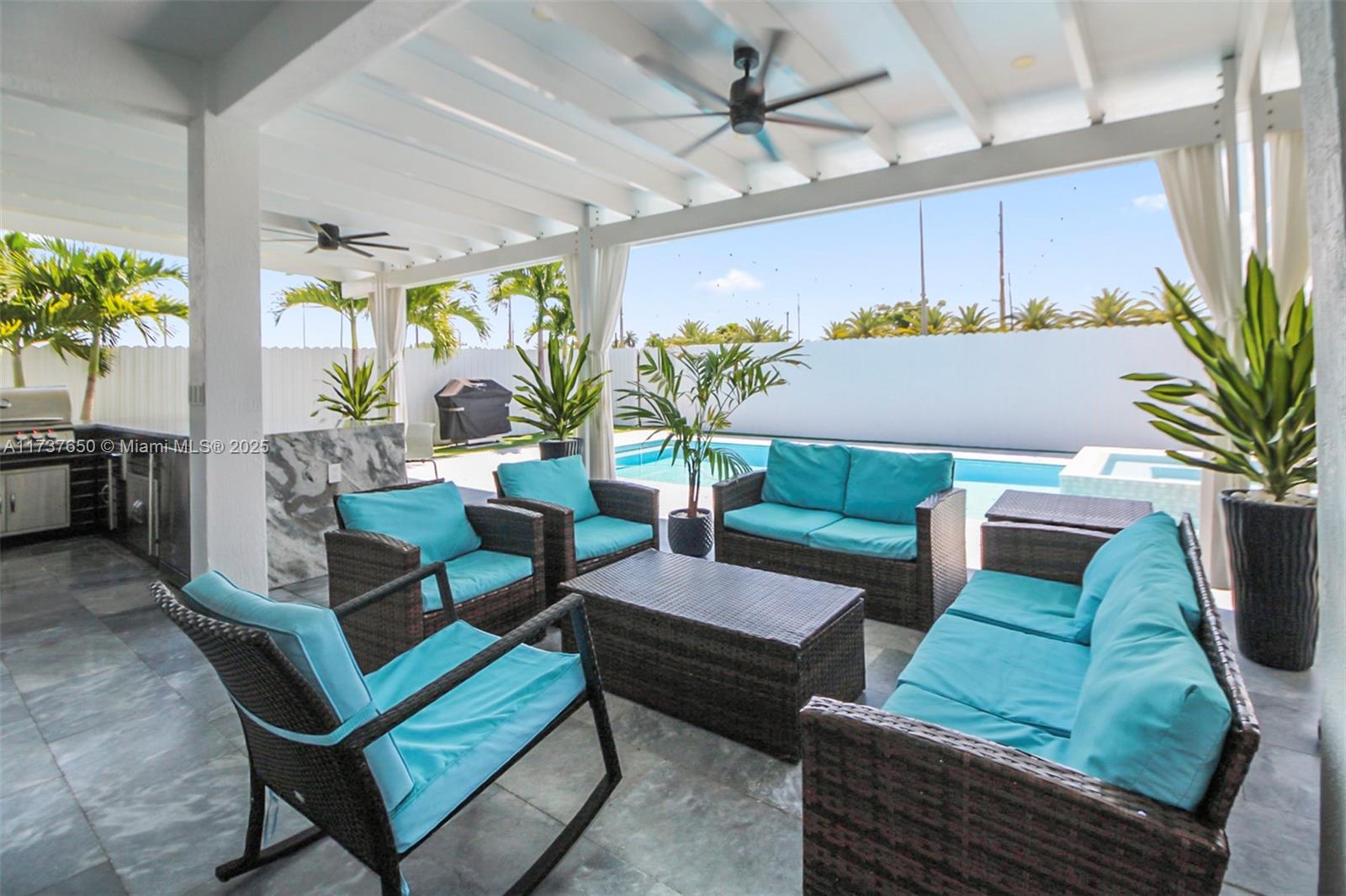 10290 Southwest 7th Terrace Sweetwater, FL 33174 - Photo 41 of 58 a living room with patio furniture and a potted plant