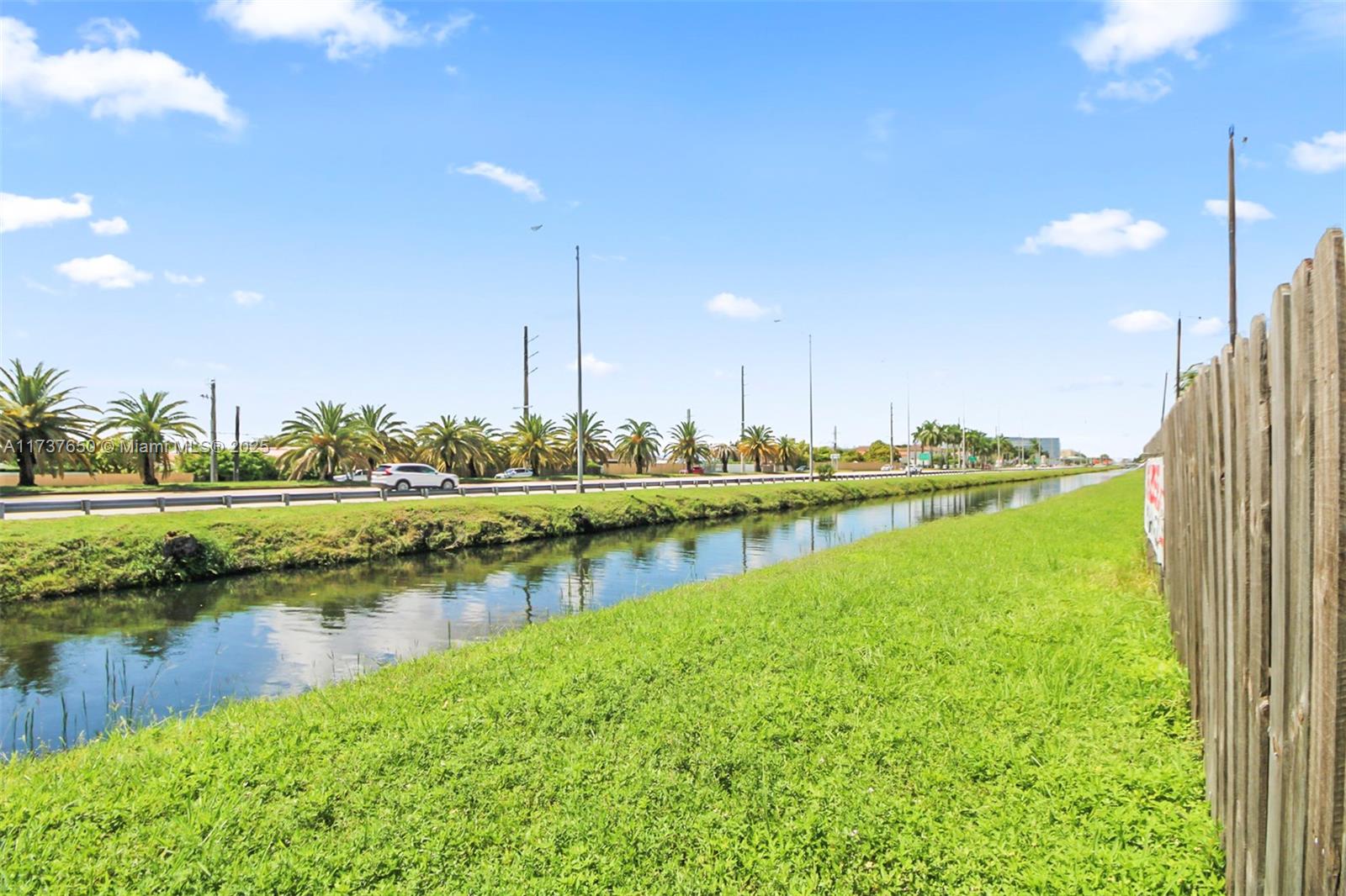 10290 Southwest 7th Terrace Sweetwater, FL 33174 - Photo 44 of 58 a view of a lake with houses with outdoor space