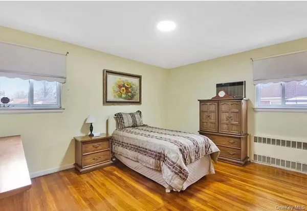 a bedroom with a bed and a table