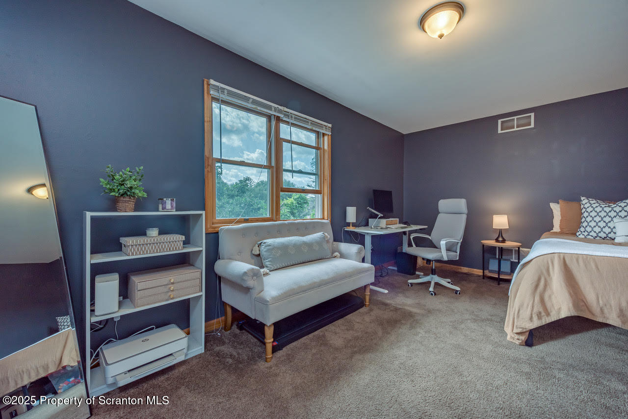 4 Scott Street Moosic, PA 18507 - Photo 16 of 23 a bedroom with furniture and a lamp