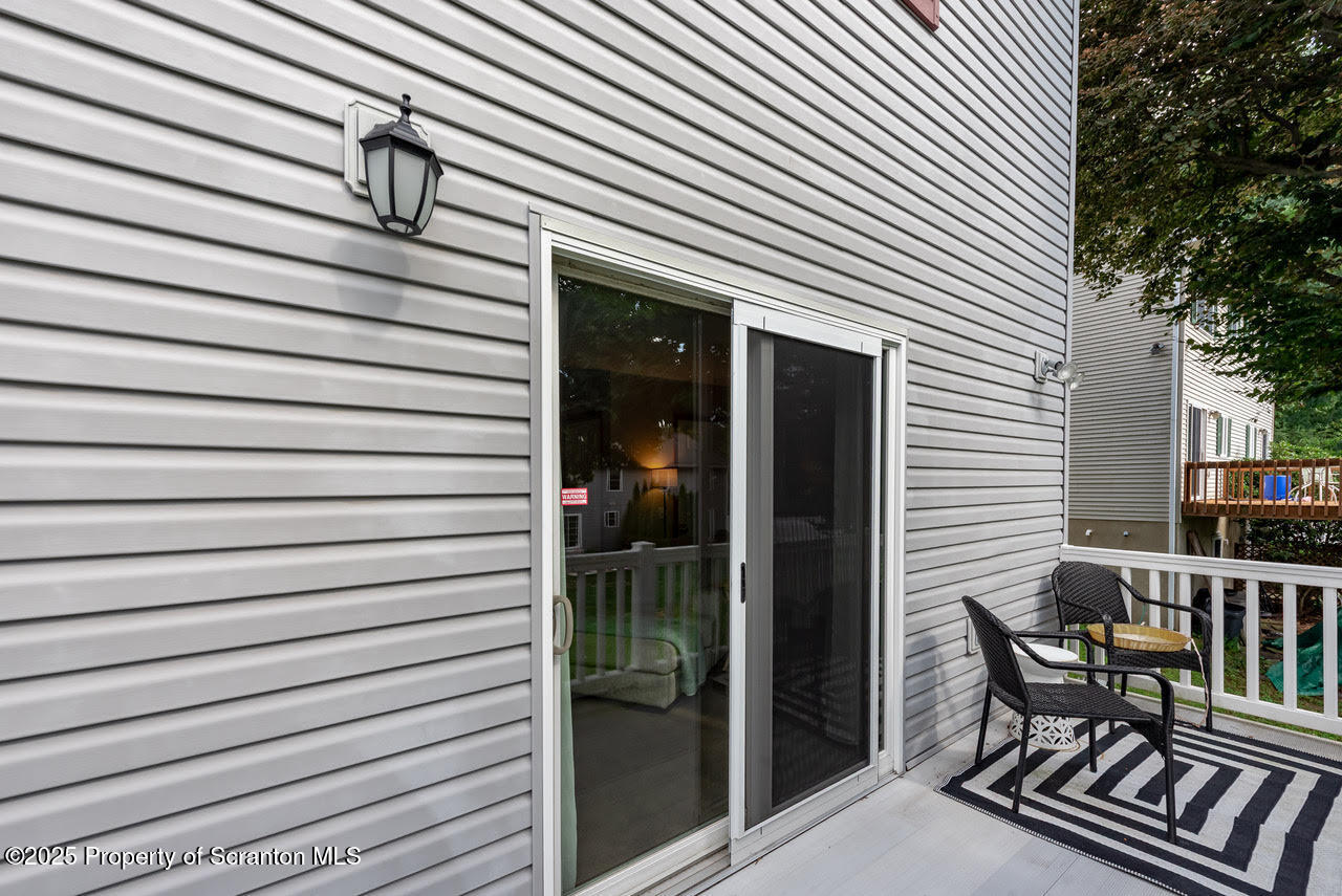 4 Scott Street Moosic, PA 18507 - Photo 23 of 23 a view of a chair and table in the balcony