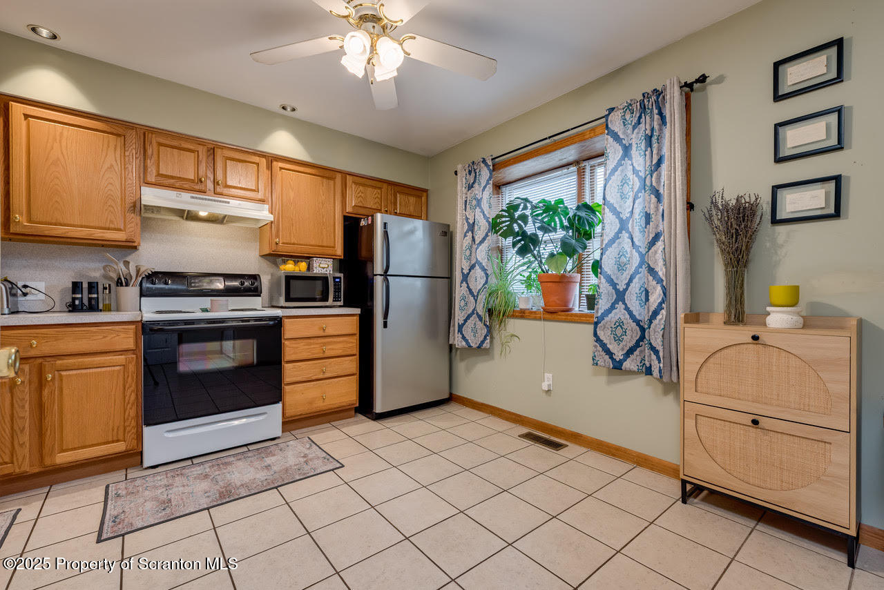 4 Scott Street Moosic, PA 18507 - Photo 3 of 23 a kitchen with a refrigerator and a stove