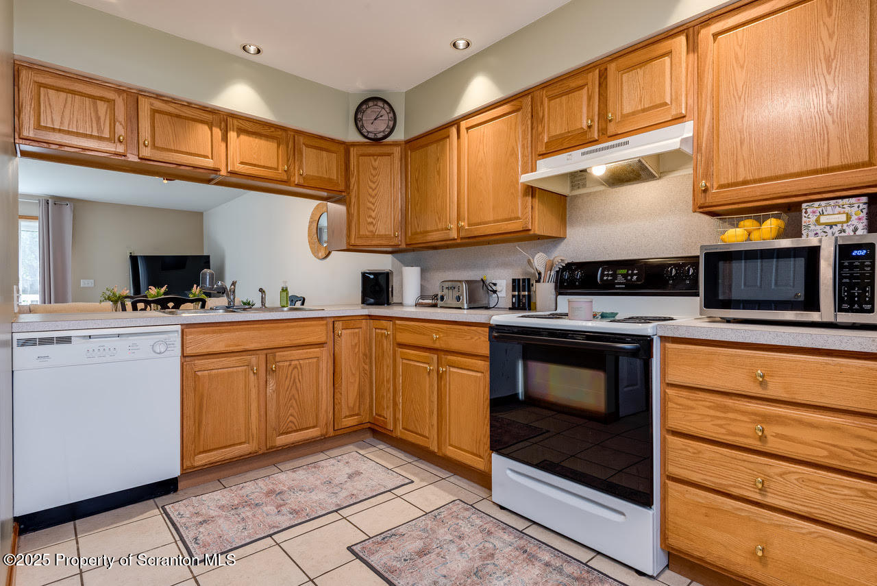 4 Scott Street Moosic, PA 18507 - Photo 5 of 23 a kitchen with granite countertop stainless steel appliances and cabinets