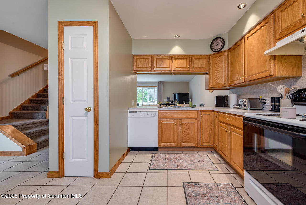 4 Scott Street Moosic, PA 18507 - Photo 6 of 23 a kitchen with stainless steel appliances granite countertop a stove a sink and a refrigerator