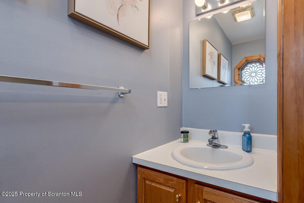 4 Scott Street Moosic, PA 18507 - Photo 7 of 23 a bathroom with a sink and a mirror