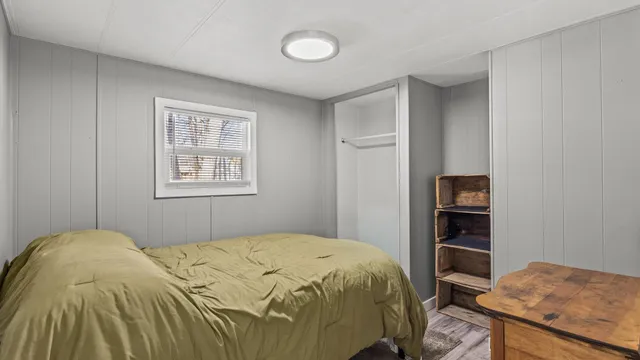 a bedroom with a bed and a cabinets