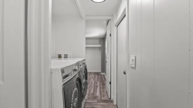 a bathroom with a sink a washer and dryer