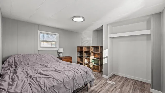 a bedroom with a bed and a closet