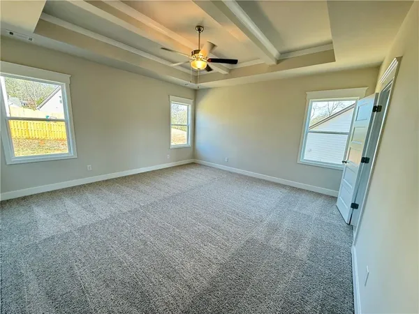 a view of an empty room with a window