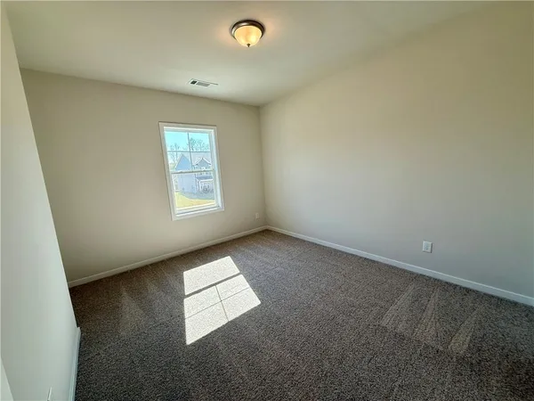 a front view of a house with parking