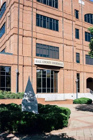 a view of a swimming pool with a yard