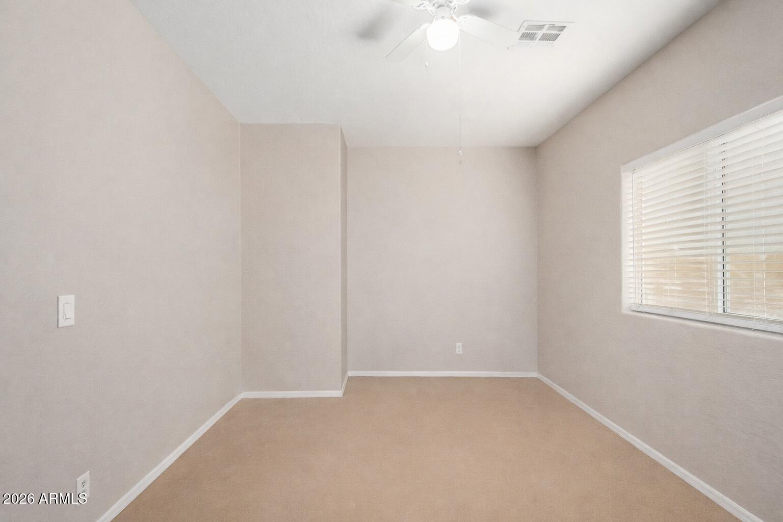 2300 East Magma Road, Unit 28 San Tan Valley, AZ 85143 - Photo 14 of 23 an empty room with a window