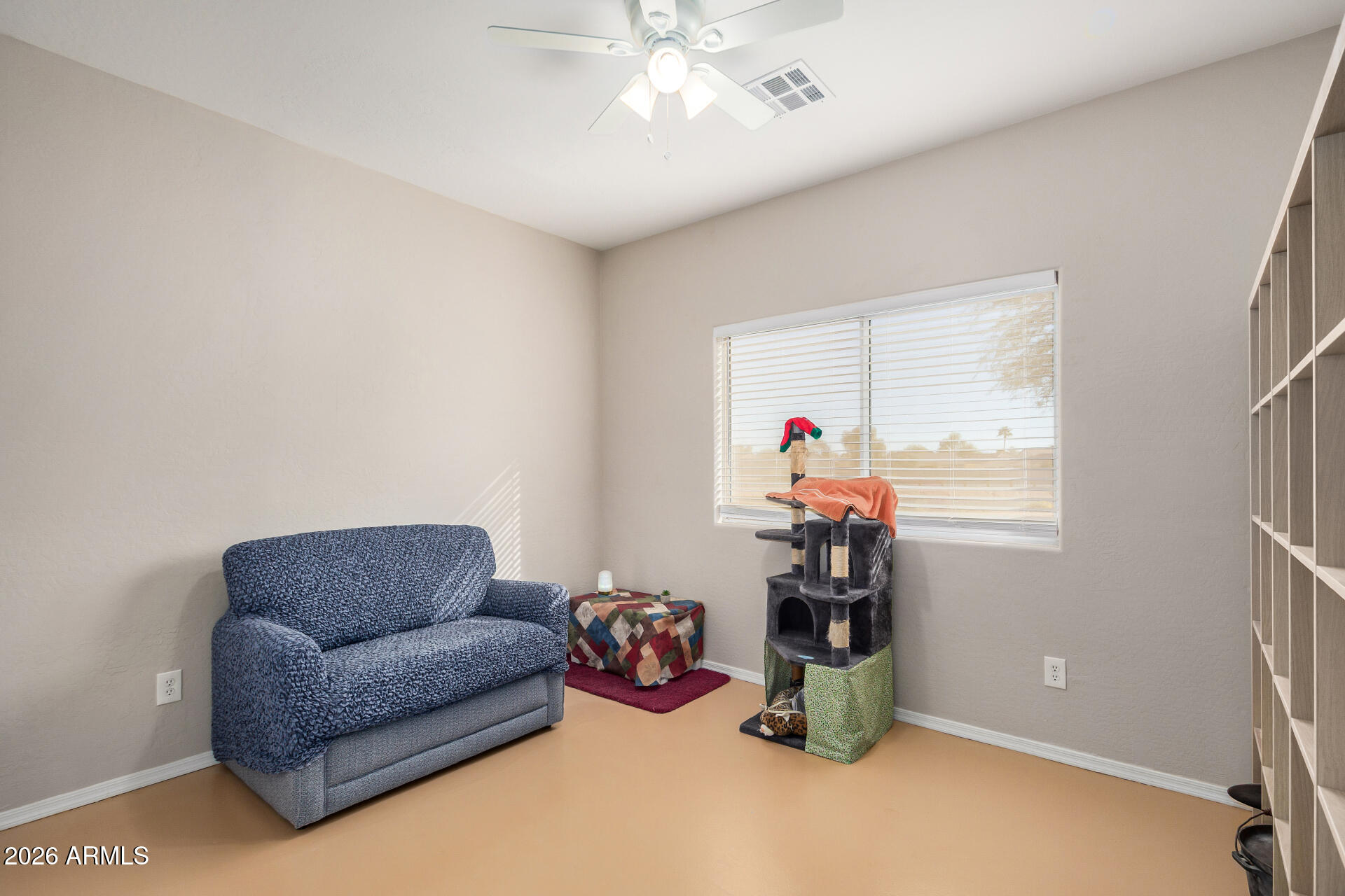 2300 East Magma Road, Unit 28 San Tan Valley, AZ 85143 - Photo 16 of 23 a living room with furniture and a chandelier