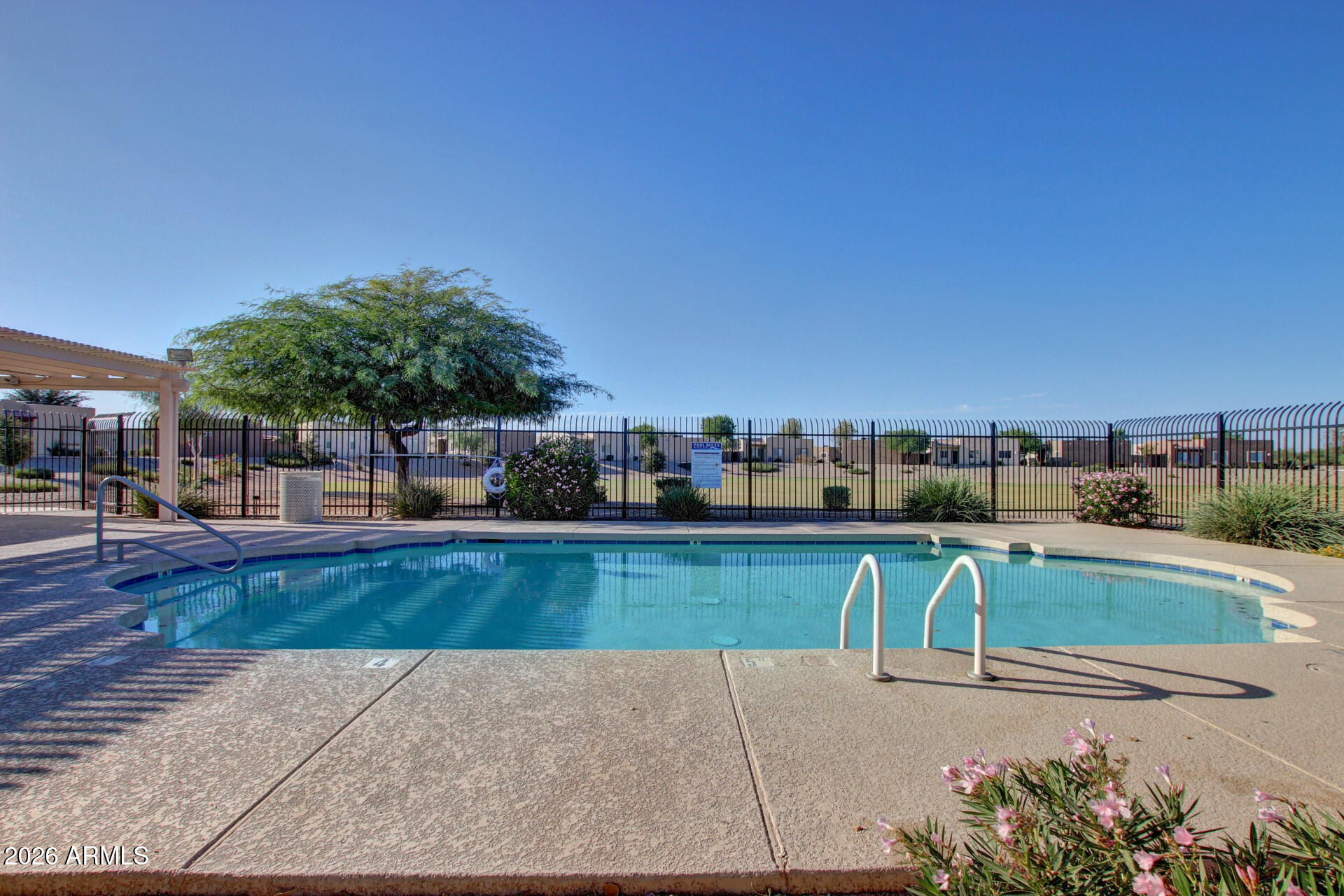 2300 East Magma Road, Unit 28 San Tan Valley, AZ 85143 - Photo 21 of 23 a view of a swimming pool with a patio