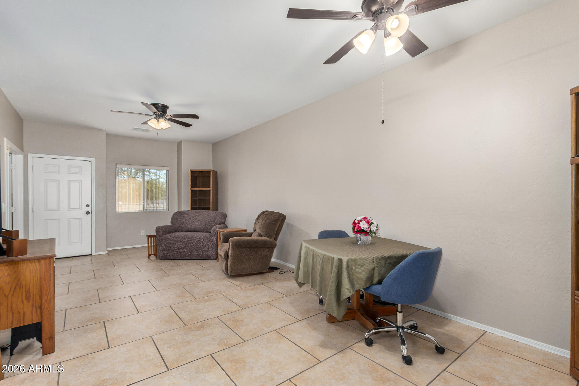 2300 East Magma Road, Unit 28 San Tan Valley, AZ 85143 - Photo 8 of 23 a living room with furniture and a ceiling fan