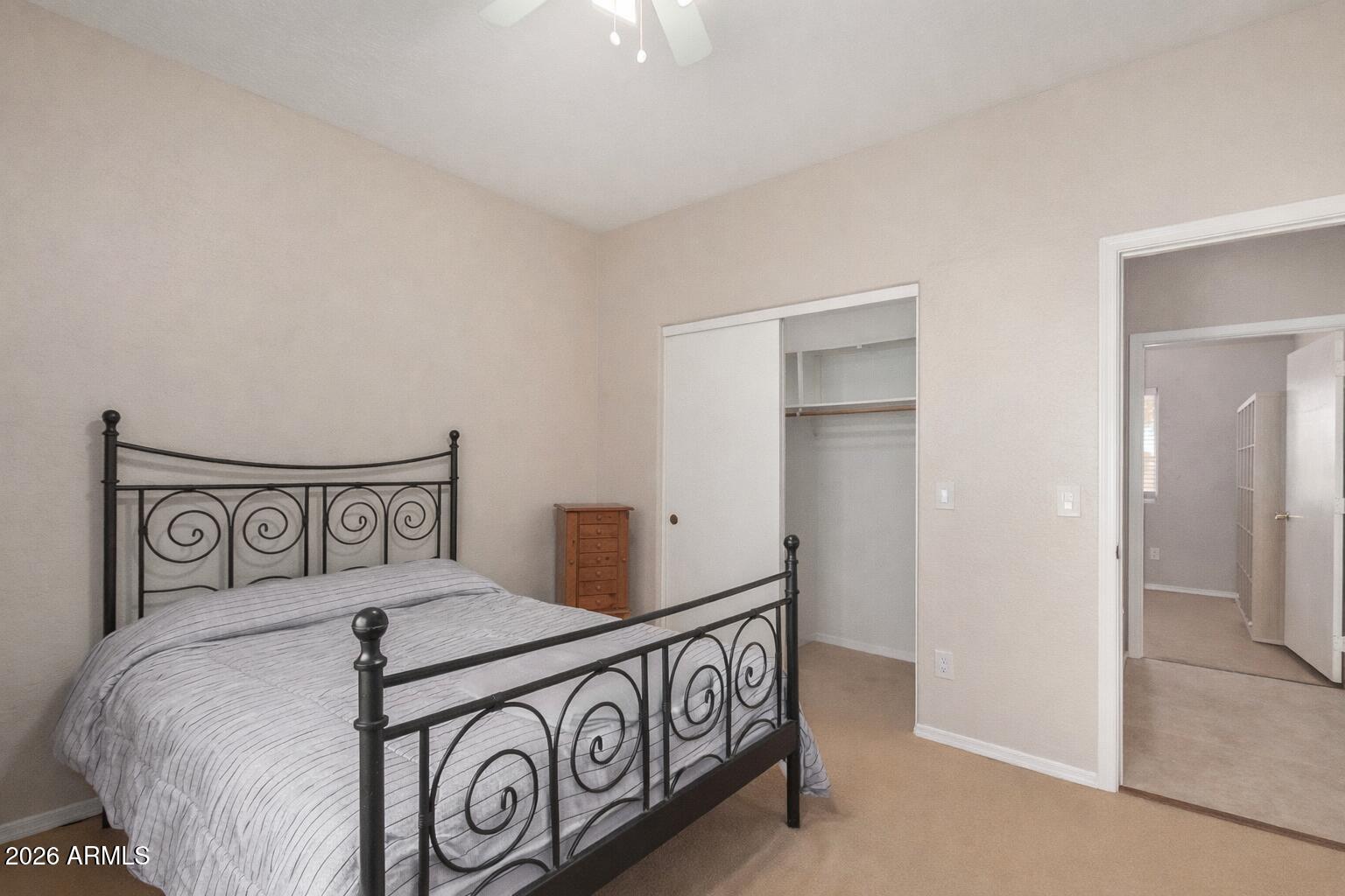 2300 East Magma Road, Unit 28 San Tan Valley, AZ 85143 - Photo 10 of 23 a bedroom with a bed and a table