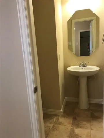 a bathroom with sink and mirror