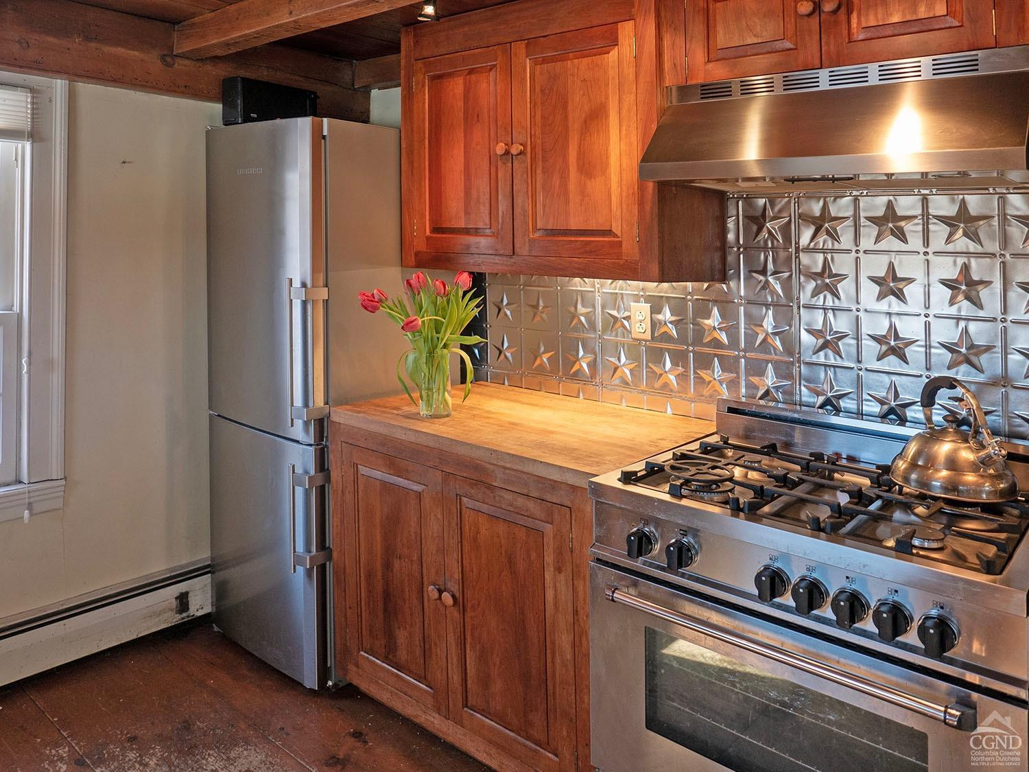 2216 County Rte 5 Canaan, NY 12029 - Photo 6 of 28 a kitchen with a stove and a refrigerator