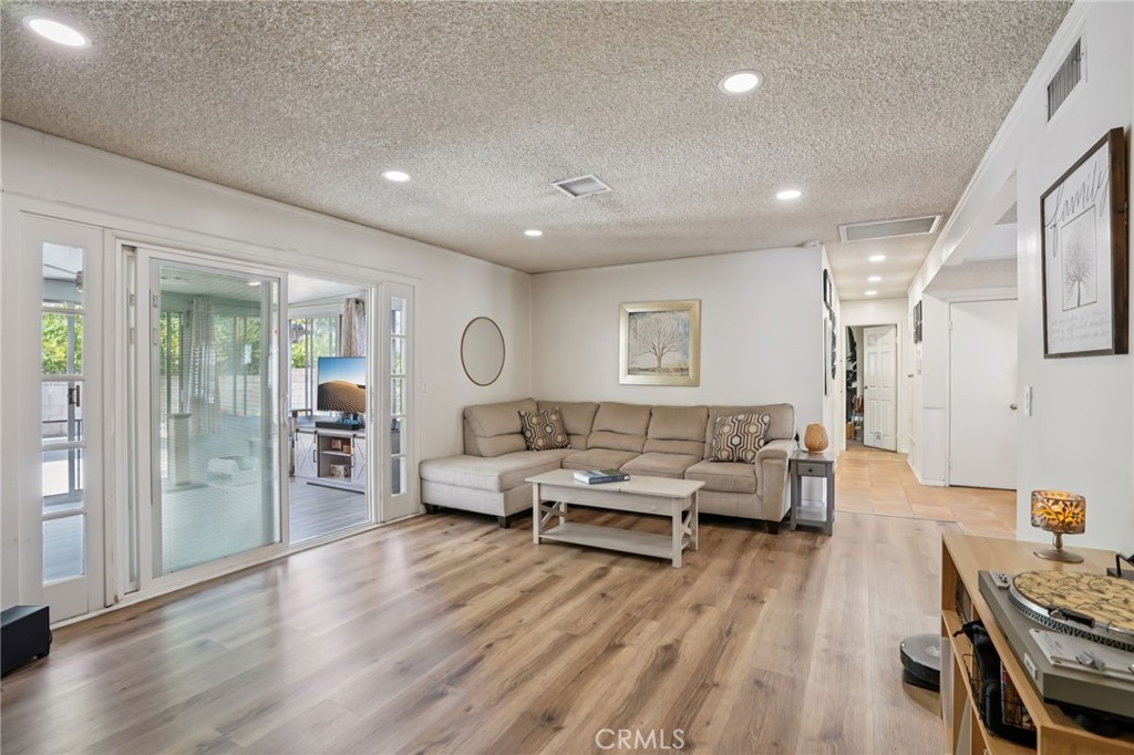 215 South Rock River Road Diamond Bar, CA 91765 - Photo 13 of 32 a living room with furniture and a wooden floor
