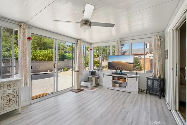 a kitchen with sink cabinets and wooden floor