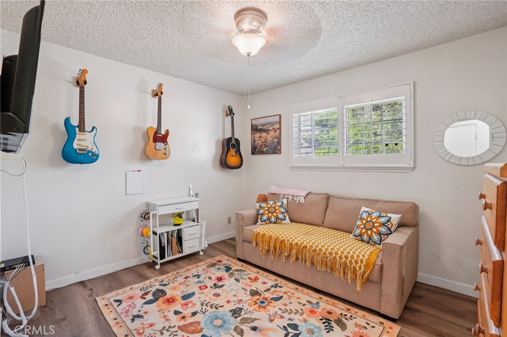 215 South Rock River Road Diamond Bar, CA 91765 - Photo 22 of 32 a living room with furniture and a window