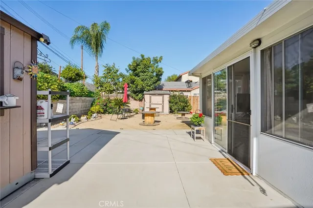 a view of a backyard with sitting area